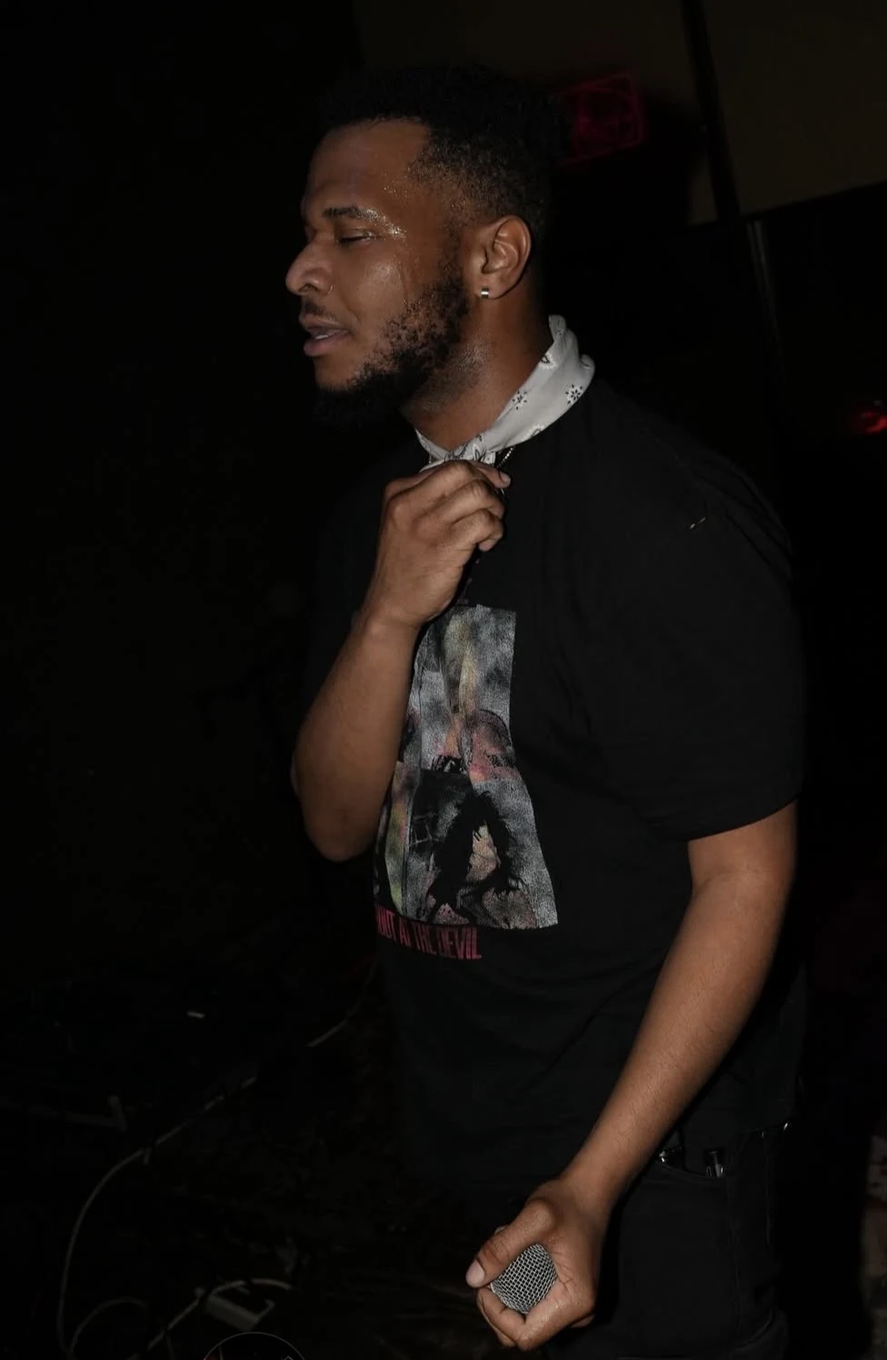 NoKissing performing with a microphone